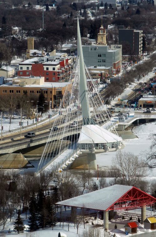 BORIS MINKEVICH / WINNIPEG FREE PRESS
Photos of the city taken from the Prairie 360 restaurant, formerly known as Revolving Restaurant (Fort Garry Place/Garry Street). Esplanade Riel is a pedestrian bridge with the Provencher Bridge to the left. Bottom/right is Scotiabank Stage @ The Forks. Feb. 8, 2017
