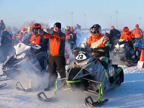 WAYNE GLOWACKI / WINNIPEG FREE PRESS 

Eighty riders from Canada and the U.S. were warming up their engines at the start of the 2017 USXC I-500 cross country snowmobile race from Winnipeg to Bemidj, MN. in the -29C temperature Wednesday morning. Draper Lundquist directs the next 2 riders to the starting line at the Red River Co-op Speedway, this race has some of the worlds best snowmobile racers competing for more than 500 miles over some of the toughest terrain Mother Nature can create. Feb. 8  2017