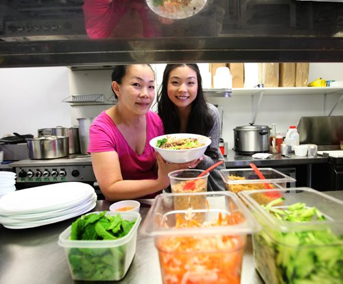 RUTH BONNEVILLE / WINNIPEG FREE PRESS

SATURDAY SPEICAL: STEINBACH GROWTH
Lien Le originally from Vietnam, moved to Steinbach from Surrey BC and started Steinbach's first Vietnamese Restaurant.  A local  Stenbach business person loved her food so much they helped finance her business interest free.  Photo with her oldest daughter, Judy in kitchen.  
See Melissa's story.   
  Feb 07,, 2017
