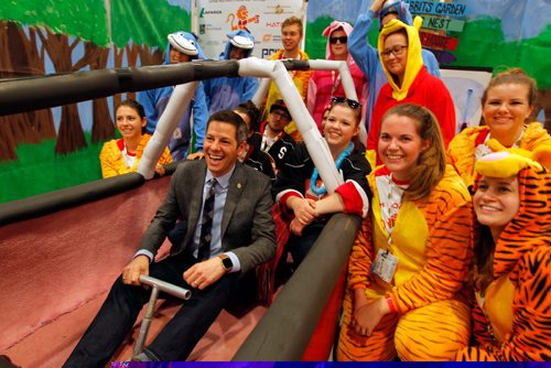 BORIS MINKEVICH / WINNIPEG FREE PRESS
Winnipeg Mayor Brian Bowman tries sitting in the cockpit of one of the entries from the University of Manitoba. It has a Winnie the Poo theme. He was there to give some informal greetings to the teams from all across the country.

info from website: The Great Northern Concrete Toboggan Race (GNCTR) is the largest student run engineering competition in Canada. Dating back to 1975, this adaptation of the American Concrete Canoe Race brings together over 450+ engineering students from universities and technical institutions across Canada. These students will be given the opportunity to apply and develop their skills in design, technical writing, networking, and management.

In February of 2017, Winnipeg will be carrying on the GNCTR tradition of teamwork, sportsmanship, school spirit, and innovation.

About the Toboggans
Competitors will be asked to design and build a toboggan which can safely carry five passengers. All toboggans must consist of an entirely concrete running surface, a structural frame, a breaking system, and a functional steering system all while weighing less than 350lbs. Teams will be judged on a number on categories including concrete mix design, frame design, steering, breaking, a technical report, race day speed, and school spirit. Teams will not be allowed to compete if their toboggans do not meet the safety and technical guidelines. Feb. 10, 2017