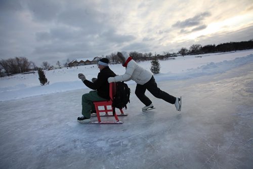 RUTH BONNEVILLE / WINNIPEG FREE PRESS

Betty Thiessen pushes her boyfriend, Chris Evans, on a chair on the River Trail on the Red River later Friday afternoon.  The couple were on a early Valentines Day date taking turns spinning each other around on the ice.  
Standup photo 
Feb 10, 2017
