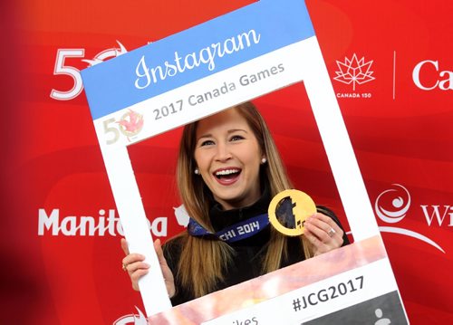 

RUTH BONNEVILLE / WINNIPEG FREE PRESS

Olympic gold medal winner in curling, Kaitlyn Lawes shows off her medal in front of Canada Summer Games backdrop for reporters  at  kick-off campaign to recruit volunteers in the Centre Court at St. Vital Centre Saturday.  

Feb 11, 2017
