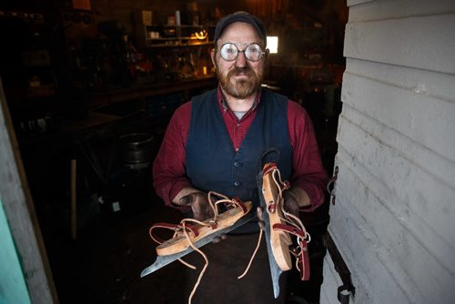 MIKE DEAL / WINNIPEG FREE PRESS
Blacksmith Matt Jenkins owner of Cloverdale Forge holds a pair of skates he made.
170131 - Tuesday, January 31, 2017.