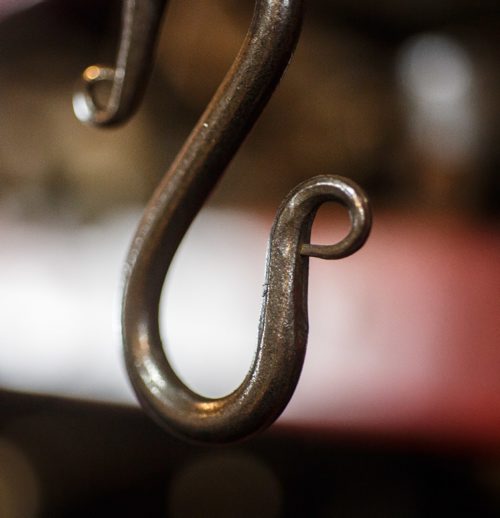 MIKE DEAL / WINNIPEG FREE PRESS
Blacksmith Matt Jenkins owner of Cloverdale Forge.
A hook hangs in the forge.
170131 - Tuesday, January 31, 2017.