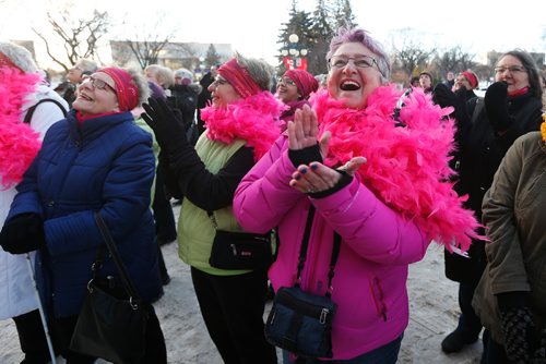 JOHN WOODS / WINNIPEG FREE PRESS
Shirley Stone cheers as the Manitoba Legislature was lit up in pink at a celebration of the 20th anniversary of the Chemo Savvy Breast Cancer Dragon Boat team, Monday, February 13, 2017.