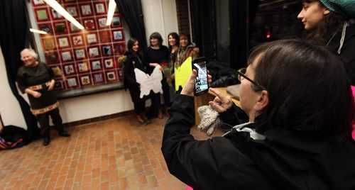 PHIL HOSSACK / WINNIPEG FREE PRESS  - Women photograph and pose with the "We Care quilt after taking part in a  "Women's Memorial March of Manitoba" at the U of W Tuesday evening in honor of Murdered and Missing Indigineous Women.   See story.  - February 13, 2017