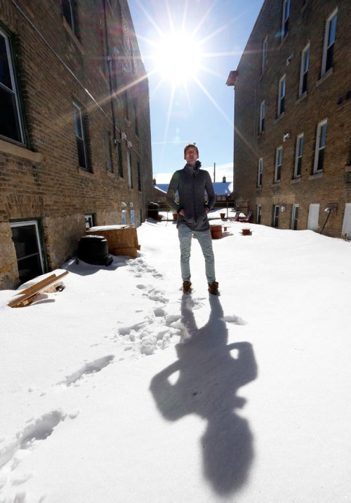 WAYNE GLOWACKI / WINNIPEG FREE PRESS

Nicolas Geddert in the courtyard of his building at right at 821 St. Paul Avenue where some residents are hoping to get a composting project up and running for people in the twin condo buildings at 819 and 821 St. Paul St. Ave. Carol Sanders Story. Feb. 15  2017