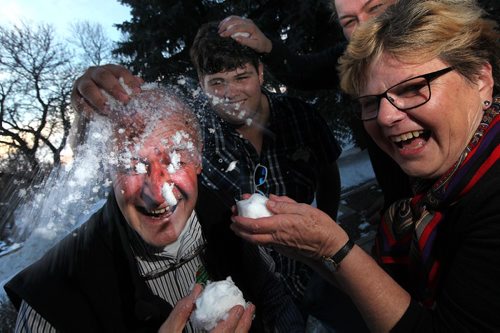 PHIL HOSSACK / WINNIPEG FREE PRESS  -  Left to right, Australians Robin MulHolland, Lachlan Doohan, Leilani Hughes (rear) and Robin's wife Bobbie MulHolland take turns smashing snowballs for the camera Wednesday afternoon.  See Jenn Zoratti story.  - February 15, 2017