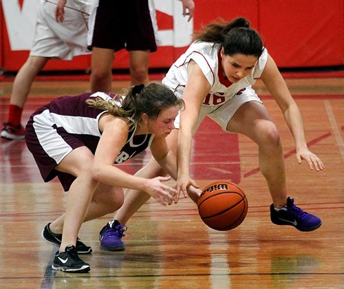 PHIL HOSSACK / WINNIPEG FREE PRESS  -  Springfield Sabre # 27 Brooke Jackson (left) and MBCI # 16 Anika Herrod attle for the ball wednesday night at MBCI. - February 15, 2017