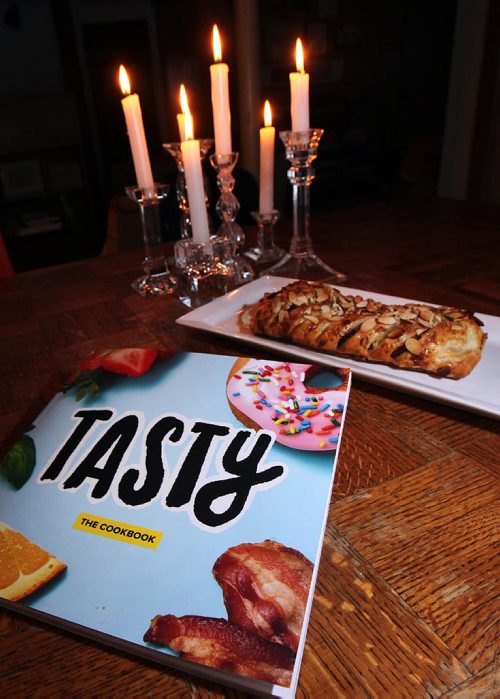 PHIL HOSSACK / WINNIPEG FREE PRESS  -  BuzzFeed's "Tasty; The Cookbook" with one recipe, chocolate almond braid behind. See Alison Gilmore's story. - February 16, 2017