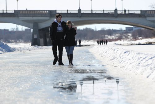 RUTH BONNEVILLE / WINNIPEG FREE PRESS

A couple walk along the Forks river trail on the Red River  as puddles of standing water accumulate Saturday.  Official's say it's still  safe to walk on but skating in most spots is too slushy. The Forks plan to put up signs to close the trail due to sloppy surface and warm weather conditions later today. 
 
Feb 18, 2017
