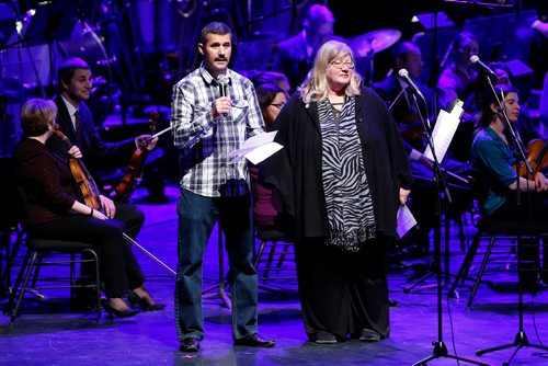 JOHN WOODS / WINNIPEG FREE PRESS
Fahed Alhalabi, who recently immigrated from Syria with his family, translates, into egyptian, the welcoming words of Winnipeg Symphony Orchestra's (WSO) Trudy Schroeder prior to the WSO's Once Upon A Dance concert Sunday, January 19, 2017. Six hundred newcomers who were invited to attend.