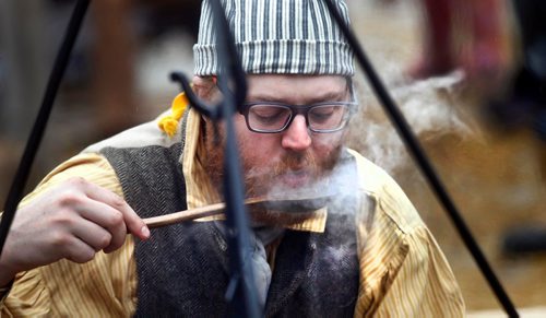 PHIL HOSSACK / WINNIPEG FREE PRESS  -  Fort Gilbralter Cook, James Young samples a steamy ladle of stew he brewed up for a damp Festival du Voyageur meal at Whittier Park. See Alex Paul story. - February 20, 2017