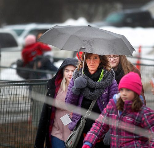 PHIL HOSSACK / WINNIPEG FREE PRESS  -  Umbrellas and gumboots were the accessory of the day as festival goers made their way into Whittier Park for Festival du Voyageur. See Alex Paul story. - February 20, 2017
