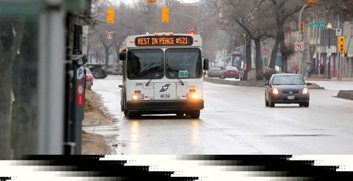 BORIS MINKEVICH / WINNIPEG FREE PRESS
REST IN PEACE #521 is on busses today in Winnipeg. Photo taken on Main Street near City Hall. Feb. 21, 2017