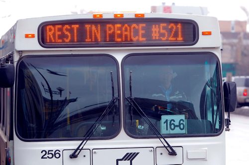 BORIS MINKEVICH / WINNIPEG FREE PRESS
REST IN PEACE #521 is on busses today in Winnipeg. Photo taken on Main Street near City Hall. Feb. 21, 2017