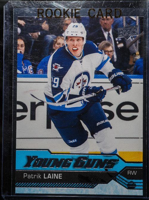 MIKE DEAL / WINNIPEG FREE PRESS
Mike Bergmann owner of Lower Level Sports Cards on Henderson Hwy has the newly released Patrik Laine Young Guns rookie hockey card.
170221 - Tuesday, February 21, 2017.
