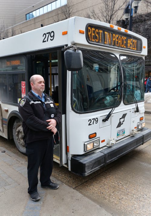 WAYNE GLOWACKI / WINNIPEG FREE PRESS
A Winnipeg Transit driver on Graham Ave. Tuesday observed a moment of silence on Tuesday at 1 P.M.in honour of murdered fellow driver Irvine Jubal Fraser.Feb. 21  2017