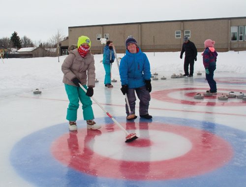 Canstar Community News Feb. 13, 2017 - Grade 4 students Ella Schmidt (left) and Samuel Kasdorf of Donwood School (400 Donwood Dr.) practiced skipping teams of their classmates leading up to the school's annual bonspiel on Feb. 14. Both said that they were new to curling, and enjoyed how competitive the sport can be. (SHELDON BIRNIE/CANSTAR/THE HERALD).