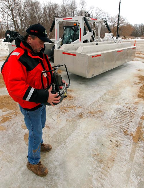 BORIS MINKEVICH / WINNIPEG FREE PRESS

Director of operations, North Red Waterway maintenance, Darrell Kupchik with a remote controlled ice cutter at the end of Main, north of Selkirk, MB. This was the only piece of equipment left in the make shift home base for the ice breaking operation. The Amphibex Icebreakers were down the Red River several miles. No access to that area. Manitoba Infrastructure reminds river users to observe warning signs and stay clear of equipment as ice-cutting machines and icebreakers take to the north Red River between Netley Creek and Netley Lake north of Selkirk starting today. February 22, 2017