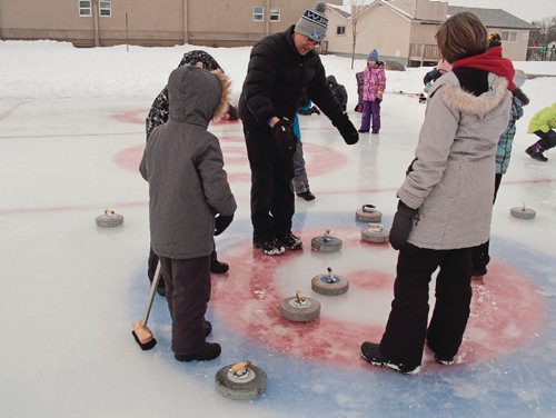 Canstar Community News Feb. 13, 2017 - Phys ed teacher Brian Vanderhooft teaches students at Donwood School (400 Donwood Dr.) about curling on the school's outdoor rink, which he maintains throughout the winter. (SHELDON BIRNIE/CANSTAR/THE HERALD)