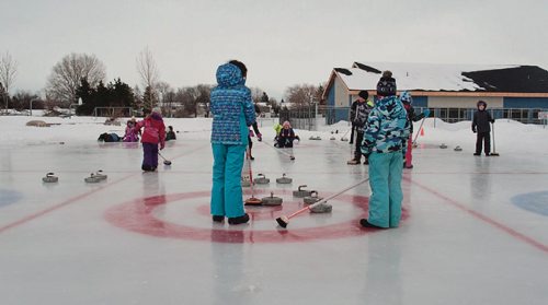 Canstar Community News Feb. 13, 2017 - Grade 4 students at Donwood School (400 Donwood Dr.) practice their game on their school's three outdoor curling sheets in anticipation of the school's outdoor bonspiel on Feb. 14. (SHELDON BIRNIE/CANSTAR/THE HERALD)