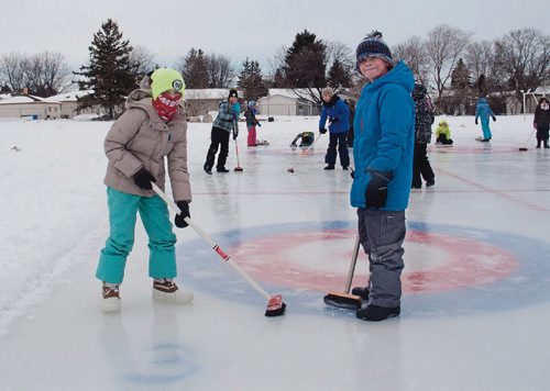 Canstar Community News Feb. 13, 2017 - Grade 4 students Ella Chmidt (left) and Samuel Kasdorf of Donwood School (400 Donwood Dr.) practiced skipping teams of their classmates leading up to the school's annual bonspiel on Feb. 14. Both said that they were new to curling, and enjoyed how competitive the sport can be. (SHELDON BIRNIE/CANSTAR/THE HERALD).