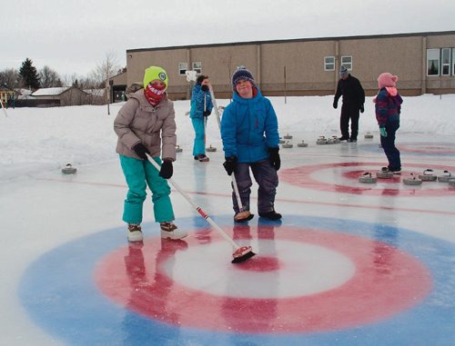 Canstar Community News Feb. 13, 2017 - Grade 4 students Ella Schmidt (left) and Samuel Kasdorf of Donwood School (400 Donwood Dr.) practiced skipping teams of their classmates leading up to the school's annual bonspiel on Feb. 14. Both said that they were new to curling, and enjoyed how competitive the sport can be. (SHELDON BIRNIE/CANSTAR/THE HERALD).