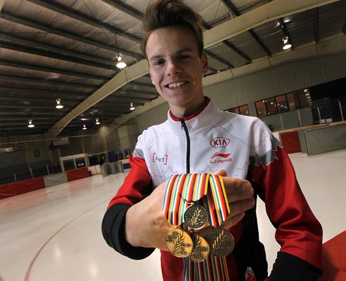 PHIL HOSSACK / WINNIPEG FREE PRESS  -  Tyson Langelaar shows off the four medals he won at the world junior speed skating championships last weekend, but was back at the St Norbert CC working out with his team mates Wednesday. See steve Lyons' story. - February 22, 2017