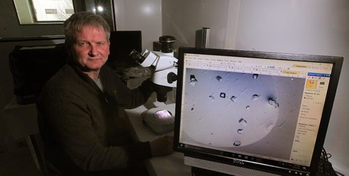 PHIL HOSSACK / WINNIPEG FREE PRESS  -  Dr. Jorg Stefeld, who is studying in his lab how the venom of one of the world's deadliest snakes could lead to potential new treatments for heart attack and stroke. He poses with a magnified specimen of the crystalized venom displayed on a monitor from the microscope in front of him. Joel Schesinger story. - February 22, 2017