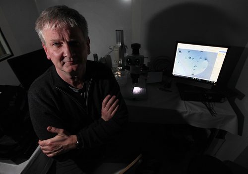 PHIL HOSSACK / WINNIPEG FREE PRESS  -  Dr. Jorg Stefeld, who is studying in his lab how the venom of one of the world's deadliest snakes could lead to potential new treatments for heart attack and stroke. He poses with a magnified specimen of the crystalized venom displayed on a monitor from the microscope behind him. Joel Schesinger story. - February 22, 2017