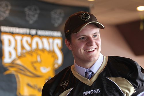 
RUTH BONNEVILLE / WINNIPEG FREE PRESS

Seventeen-year-old Cole Adamson smiles while talking with his family after signing with the Manitoba Bisons football team as a defensive player at press confers e at Smitty's Restaurant Thursday.  

See Mike Sawatsky's story.




Feb 23, 2017
