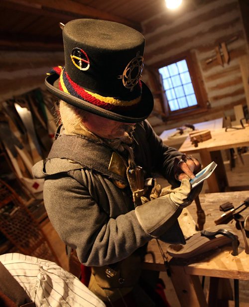 PHIL HOSSACK / WINNIPEG FREE PRESS  - Old and New -Fort Gibralter's Senior Clerk Seraphian Lamarre uses a cell phone to enter some data (his name for my caption) at Whittier Park Friday evening as Festival du Voyageur enter's the second weekend.  - February 24, 2017