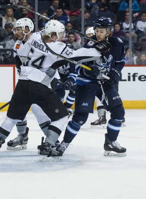 MIKE DEAL / WINNIPEG FREE PRESS
Manitoba Moose' JC Lipon (34) is hit with a high stick from San Antonio Rampage' Anton Lindholm (54) in AHL season action at the MTS Centre Sunday afternoon. 
170226 - Sunday, February 26, 2017.
