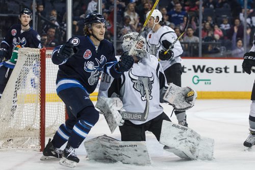 MIKE DEAL / WINNIPEG FREE PRESS
Manitoba Moose' JC Lipon (34) celebrates a goal against San Antonio Rampage' goaltender Spencer Martin (30) in AHL season action at the MTS Centre Sunday afternoon. 
170226 - Sunday, February 26, 2017.