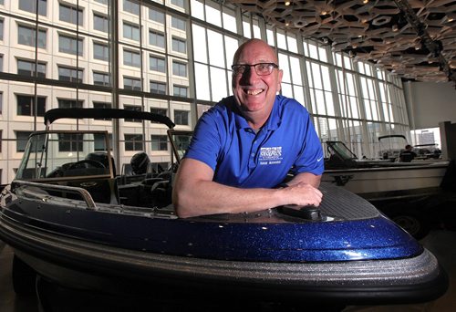PHIL HOSSACK / WINNIPEG FREE PRESS  -  An excited Dave Amey poses in one of the many boats being set up for this week's Boat Show at the Convention Centre. Dave Manages the event, see Willy's story.  - February 27, 2017