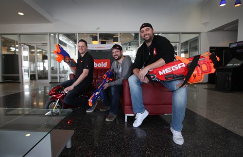RUTH BONNEVILLE / WINNIPEG FREE PRESS

BOLD Commerce

Bold owners Jason Myers (front right), Eric Boisjoli (centre), Stefan Maynard and Yvan Boisjoli (not in photo), love to play as hard as they work.  Photo of 3 of the 4 owners in front foyer with their toy shooters.  
Story:. BOLD is a ecommerce business that develop Shopify apps, basic online store setups to complete custom design and development solutions.  
This is running with Kelly Taylor's 49.8 feature on Manitoba 150. Innovation and technology advances in MB.
Feb 25, 2017
