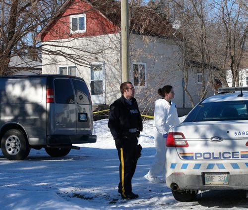 WAYNE GLOWACKI / WINNIPEG FREE PRESS

RCMP officers at the scene of a double homicide at a house (background) in St-Georges, Mb. Tuesday. Bill Redekop  story Feb. 28   2017