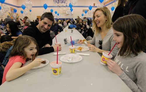 BORIS MINKEVICH / WINNIPEG FREE PRESS
STANDUP -  Robert H Smith School's Community Breakfast. All Proceeds Go to The True North Youth Foundation's Project 11 Mental Health Awareness for Kids.  From left: The Coulter family; Charlotte,5, Kris (dad) ,Kira (mom), and Jillian ,8, enjoy some breakfast at the event. March 3, 2017 170303