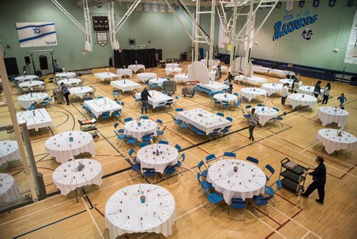 DAVID LIPNOWSKI / WINNIPEG FREE PRESS

Volunteers set up Shabbat  dinner tables at the Rady Jewish Community Centre Friday March 3, 2017 in preparation for a community wide Shabbat dinner where 400 attendees are expected. Winnipeg synagogues are cooperating on this event, and similar events  across Canada and the US are happening on Friday night as well. 
