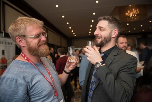 DAVID LIPNOWSKI / WINNIPEG FREE PRESS

Friends Justin Bender (left) and Brett Gladstone (right) take in the 2017 Winnipeg Whiskey Festival Friday March 3, 2017 at the Fairmont Hotel.