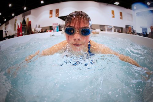 JOHN WOODS / WINNIPEG FREE PRESS
Halle Dupre tries out a swim spa 14' training pool at the Boat Show at the downtown convention centre Sunday, March 5, 2017.
