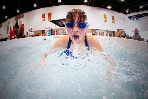 JOHN WOODS / WINNIPEG FREE PRESS
Halle Dupre tries out a swim spa 14' training pool at the Boat Show at the downtown convention centre Sunday, March 5, 2017.