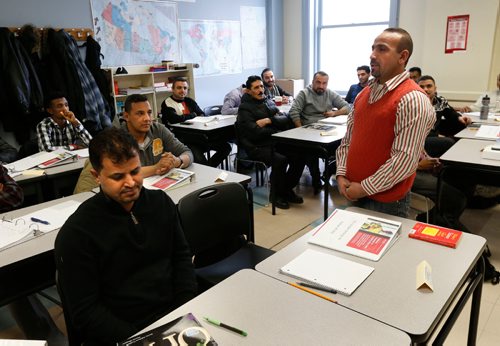At right, Farhan Alfaraeij introduces himself in english beside Wasel Alanis seated at left during their english language class part of the new construction skills pilot program that was announced Tuesday by the Province of Manitoba and Red River College. The RRC's Language Training is in the South Wing 123 Main Street (Via Rail Station).  For Bill Redekop  story  March 7    2017