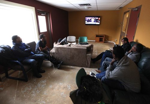 PHIL HOSSACK / WINNIPEG FREE PRESS  - Hurry up and wait - After risking  everything and finally seeking safety by walki g across the US border at Emerson into Canada, Asylum seekers watch the news in a  common room at the Salvation Army Shelter.  Melissa Martin story.  -  March 3, 2017