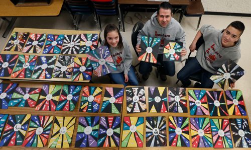 WAYNE GLOWACKI / WINNIPEG FREE PRESS

 In centre, West St. Paul School teacher Kevin Rempel is going to Guatemala during spring break to volunteer to help build a school in a village called El Tizate.  He is taking about 100 pieces of art created by student in grades 2-8. Christian La,13 and Halle Dupre,13 are holding their art that their teacher Kevin will also be taking with him on his trip.    Ashley Prest story  March 8    2017