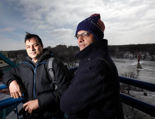 49.8 FEATURE :  
PHIL HOSSACK / WINNIPEG FREE PRESS  - Shahadat Hossain (right) and Subir Barman pose at The Forks observation tower Wednesday morning.  Randy Turner / Melissa Martin story.  -  March 3, 2017