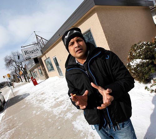 49.8 FEATURE :  
PHIL HOSSACK / WINNIPEG FREE PRESS  - Subir Barman talks while taking a smoke break outside the Falafel Place Wednesday morning.  Randy Turner / Melissa Martin story.  -  March 3, 2017