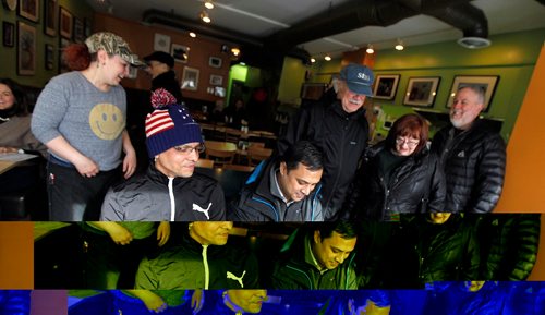 49.8 FEATURE :  
PHIL HOSSACK / WINNIPEG FREE PRESS  - Word spreads through the restraunt and Shahadat Hossain (left) and Subir Barman are congratulated by a group of Americans for getting across the border into Canada. Waitress Alyssa Hendler (left) works the table.  Randy Turner / Melissa Martin story.  -  March 3, 2017
