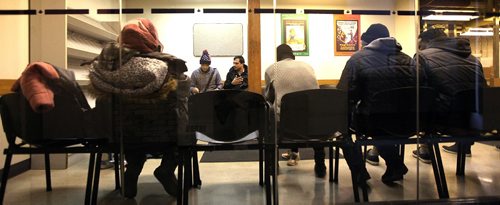 49.8 FEATURE :  
PHIL HOSSACK / WINNIPEG FREE PRESS  - Hurry up and wait - Shahadat Hossain  (left) and  Subir Barmanrefelct Wait at Immigration in the Forks.  -  March 3, 2017